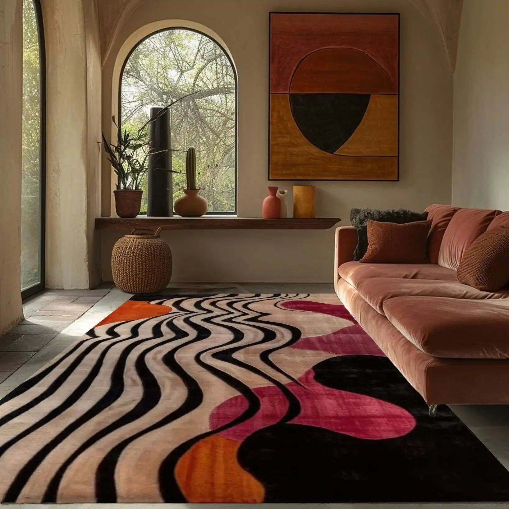 Stylish area rug in a modern living room, featuring an abstract design in bold colors like black, pink, and orange. This hand-tufted wool rug adds a touch of elegance and warmth, perfect for large areas in offices or living rooms.