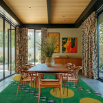 A stylish dining room featuring a vibrant hand-tufted wool rug with bees and suns design. This colorful area rug adds a playful touch to the elegant interior, perfect for dining room area rugs or as rugs for the living room.