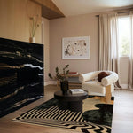 Stylish living room featuring an area rug with black and gold stripes, perfect for adding elegance to living room and dining room spaces. The wool rug complements the modern decor with its abstract design, making it an ideal dining table rug or a centerpiece in the living room.