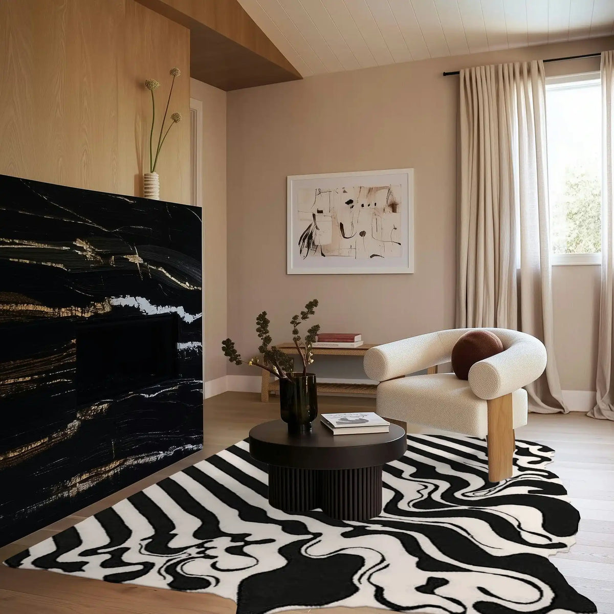 A stylish black and white melting hand-tufted wool area rug enhances a modern living room setting. The large living room rug features an abstract pattern, complementing a cozy, neutral-toned space with a sleek black coffee table and a comfortable armchair. Perfect for both offices and living rooms, this rug adds a touch of elegance and warmth.