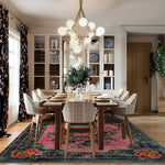 Elegant dining room featuring a Blossom Floral Elegance Hand Tufted Area Rug. This wool square rug enhances the space with its vibrant floral design, perfect for a large living room. The rug's intricate patterns and rich colors add warmth and sophistication, making it an ideal choice for rugs for living room settings.