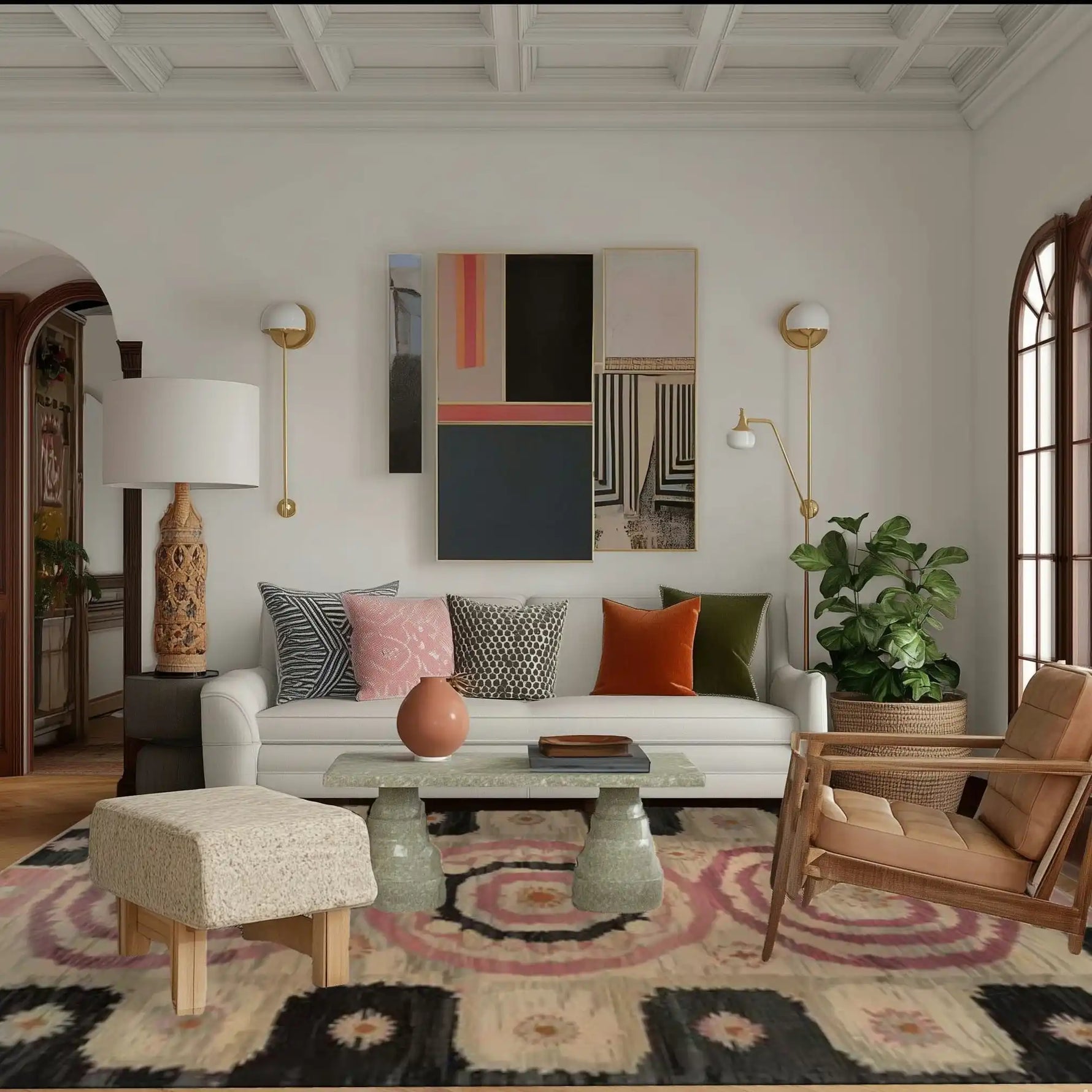 Stylish living room featuring a Blossom Mandala Hand Tufted Area Rug. This wool rug showcases a captivating mandala design, perfect for enhancing the aesthetics of a living or dining room. The room is elegantly decorated with modern furniture, including a white sofa, patterned cushions, and indoor plants, creating a cozy and inviting atmosphere.