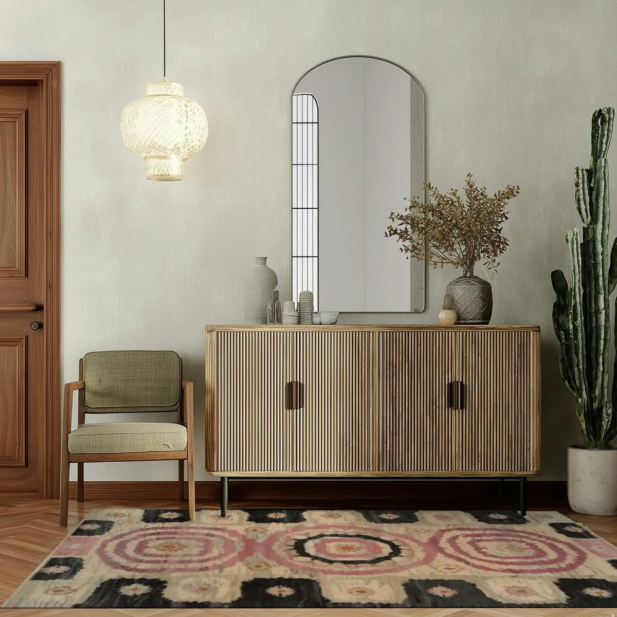 A beautifully styled living room featuring the Blossom Mandala Hand Tufted Wool Rug. This area rug adds a touch of elegance with its intricate patterns and soft textures, perfect for both living room and dining room settings. The warm tones complement the modern decor, creating a cozy and inviting atmosphere.