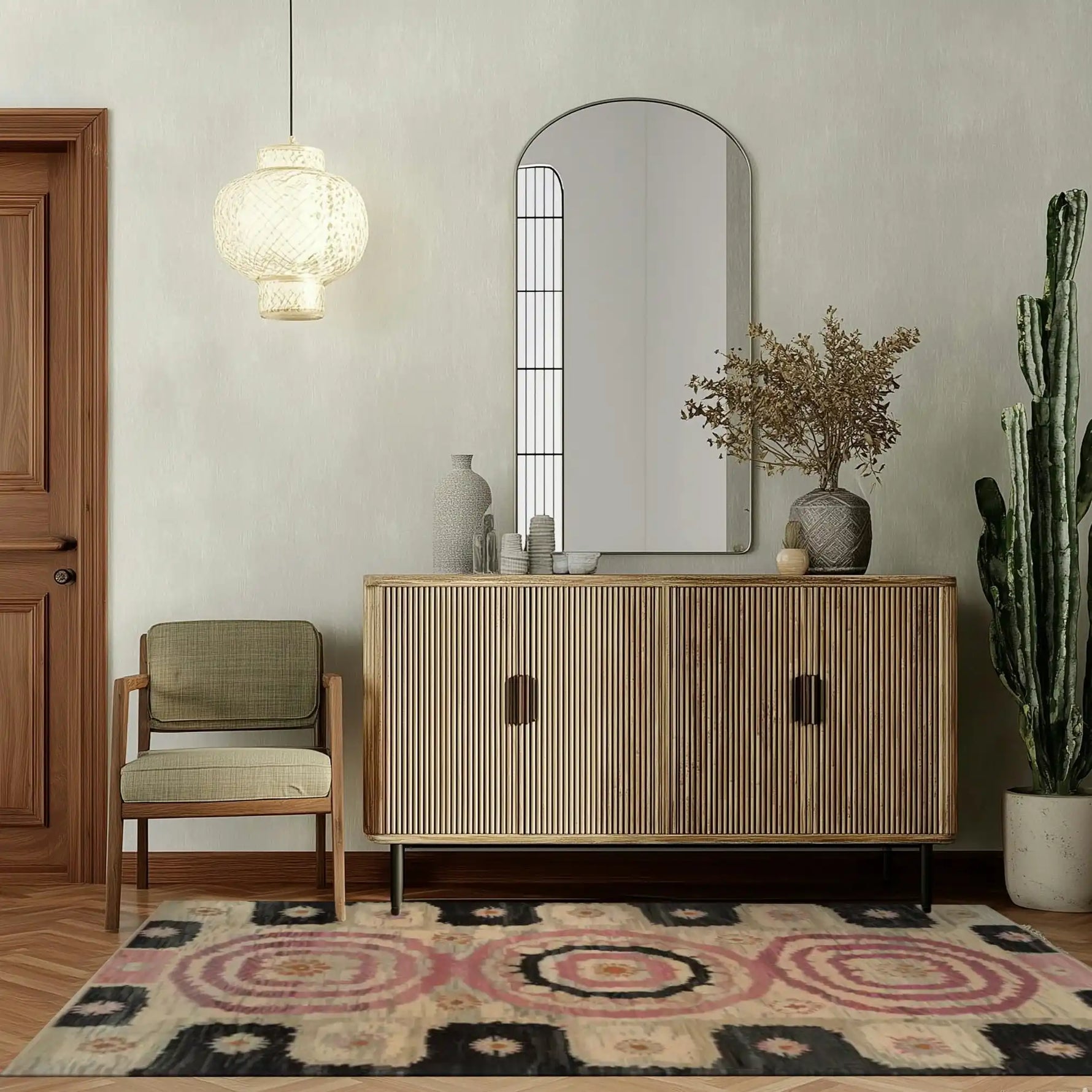 A beautifully styled living room featuring the Blossom Mandala Hand Tufted Wool Rug. This area rug adds a touch of elegance with its intricate patterns and soft textures, perfect for both living room and dining room settings. The warm tones complement the modern decor, creating a cozy and inviting atmosphere.