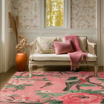 A vibrant Blossom Melody Hand Tufted Area Rug graces a cozy living room setting. This wool rug features intricate floral designs in pink and green hues, perfect as a large living room rug. The floral rug complements the elegant decor, including a classic settee adorned with decorative pillows and a soft throw. Perfect for those seeking stylish rugs for living room spaces.
