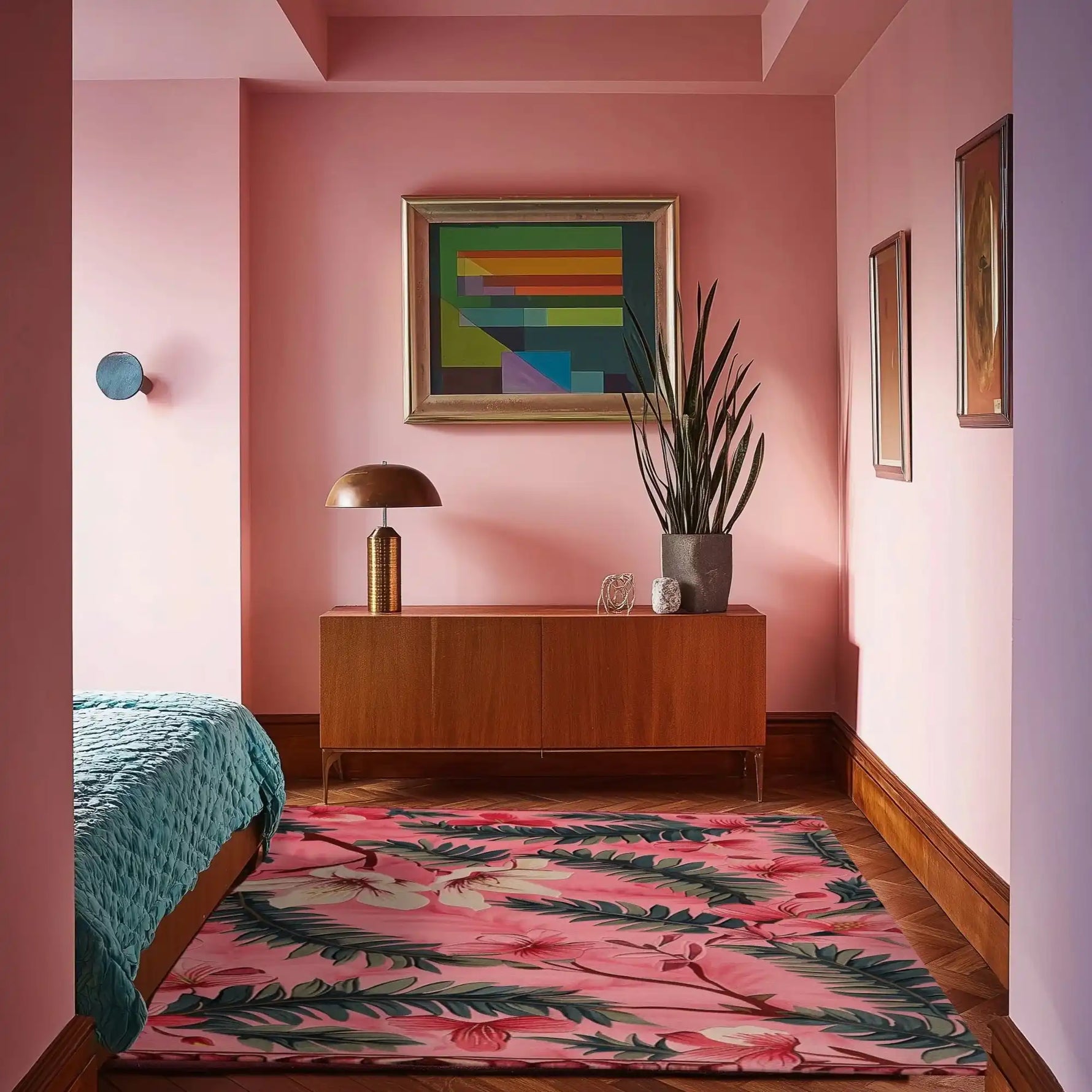 A stylish area rug with a vibrant floral design, perfect for adding a splash of color to your living room or office. The Blushing Garden Hand Tufted Rug is crafted from wool, offering a cozy and elegant touch to any space. The room features pink walls, a mid-century modern dresser, and colorful artwork, making it an inviting setting for this beautiful rug.