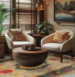 Elegant living room featuring a Botanical Grace Wool Hand Knotted Area Rug with a vintage floral design. This large 8x10 Persian-style rug adds a touch of sophistication to the space, complementing the cozy armchairs and round wooden coffee table.