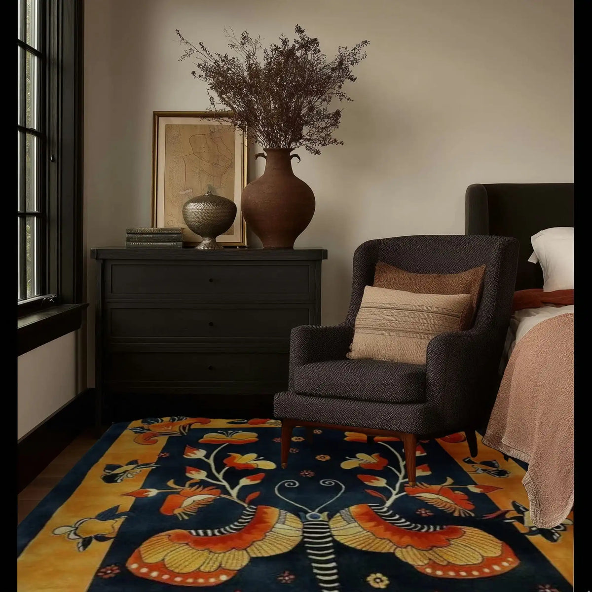 A beautifully designed bedroom featuring the Butterfly Blossom Elegance Tufted Wool Area Rug. This vibrant wool rug showcases a stunning butterfly motif, adding a pop of color and elegance to the room. Perfect for both bedroom and living room spaces, this area rug complements the cozy armchair and dark dresser, creating a warm and inviting atmosphere.