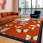 Stylish living room featuring the Butterfly Serenade Hand Tufted Area Rug in an 8x10 size. This vibrant wool rug showcases an elegant butterfly pattern, adding a touch of nature-inspired charm to the space. Perfect for enhancing modern living room decor.