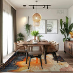 A stylish dining room featuring a Coastal Silhouette hand-tufted area rug with abstract designs in warm tones. The rug adds a touch of elegance to the room, making it perfect for a bedroom or living room. The wool rug complements the modern, cozy atmosphere with natural light streaming through large windows.