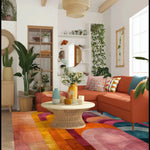 A vibrant and colorful abstract area rug adds a modern touch to a cozy living room with a warm orange sectional sofa and a woven coffee table. Perfect for living room and dining room rugs, this hand-tufted wool rug features bold geometric designs, ideal for bedrooms and dining room area rugs.