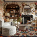 Luxurious living room with floral handmade rug, wallpaper, bookshelves, and a fireplace.