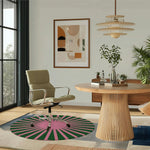 A stylish living room featuring a contemporary green and pink round hand-tufted wool area rug. This vibrant round rug adds a pop of color, perfect for modern living rooms. The image shows the rug under a sleek chair and near a wooden table, surrounded by elegant decor, embodying the ideal area rug for living room settings.