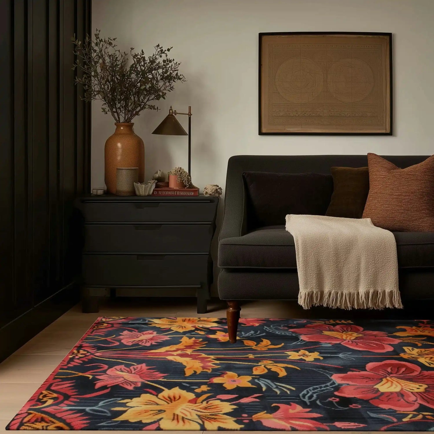 Vibrant floral wool area rug in a cozy living room setting, featuring a dark sofa with cushions, a beige throw, and a stylish side table with decor. Perfect large area rug for adding warmth and color to any living room.