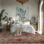Stylish bedroom featuring the Ember Floral Hand Tufted Area Rug with vibrant floral patterns in red and pink, perfect for adding a cozy touch to any living room. This wool rug enhances the warmth and elegance of the space, making it an ideal choice for those seeking beautiful living room area rugs.