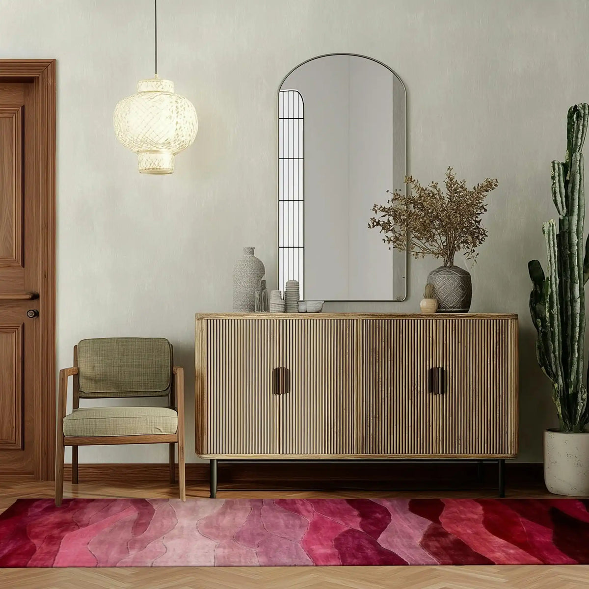 Stylish Ethereal Waves Hand Tufted Wool Runner Rug with vibrant shades of red and pink, adding a contemporary touch to the hallway. Perfect as a hallway runner rug, this area rug complements the modern decor with a wooden sideboard, a cozy chair, and a hanging light fixture. Ideal for those seeking kitchen runner rugs or living room rugs 8x10, this wool rug enhances any space with its elegant design.