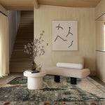 Stylish living room featuring the Evergreen Elegance Hand Tufted Area Rug. This wool rug adds a touch of sophistication with its intricate patterns, perfect for enhancing any living room or bedroom decor.