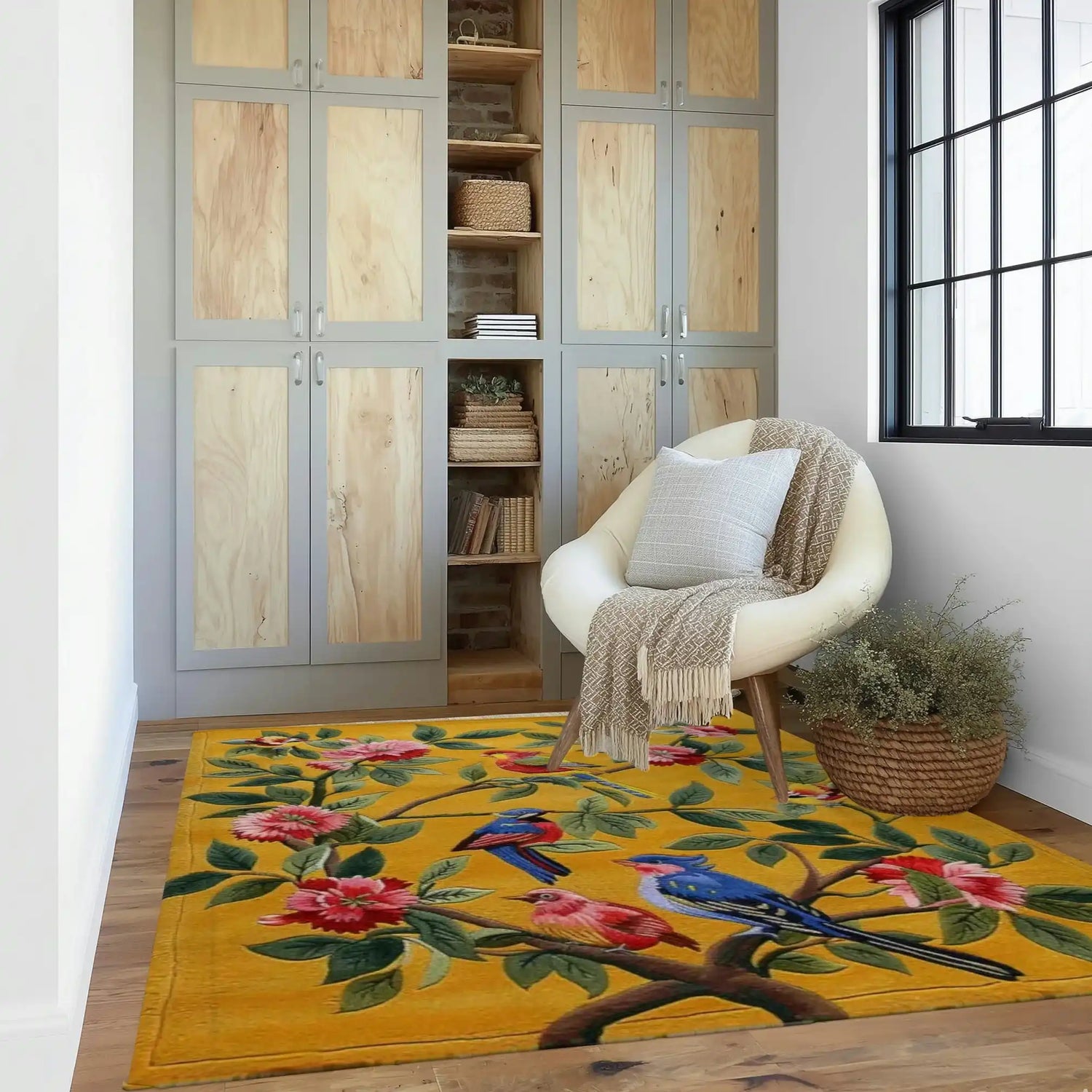 A vibrant hand-tufted wool area rug featuring colorful birds and floral patterns, beautifully complementing a cozy living room setting with a modern chair and neutral decor. This living room area rug adds a splash of color and style, perfect for enhancing any space with its detailed design.