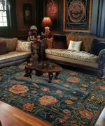 This elegant living room features a stunning Floral Elephant Wool Hand Knotted Area Rug, perfect for accentuating the space. The rug showcases intricate floral designs with elephant motifs, bringing a touch of Persian elegance to the decor. Ideal for those seeking exquisite rugs for the living room, this floral rug seamlessly blends tradition with style, making it a standout piece among area rugs for living room settings.