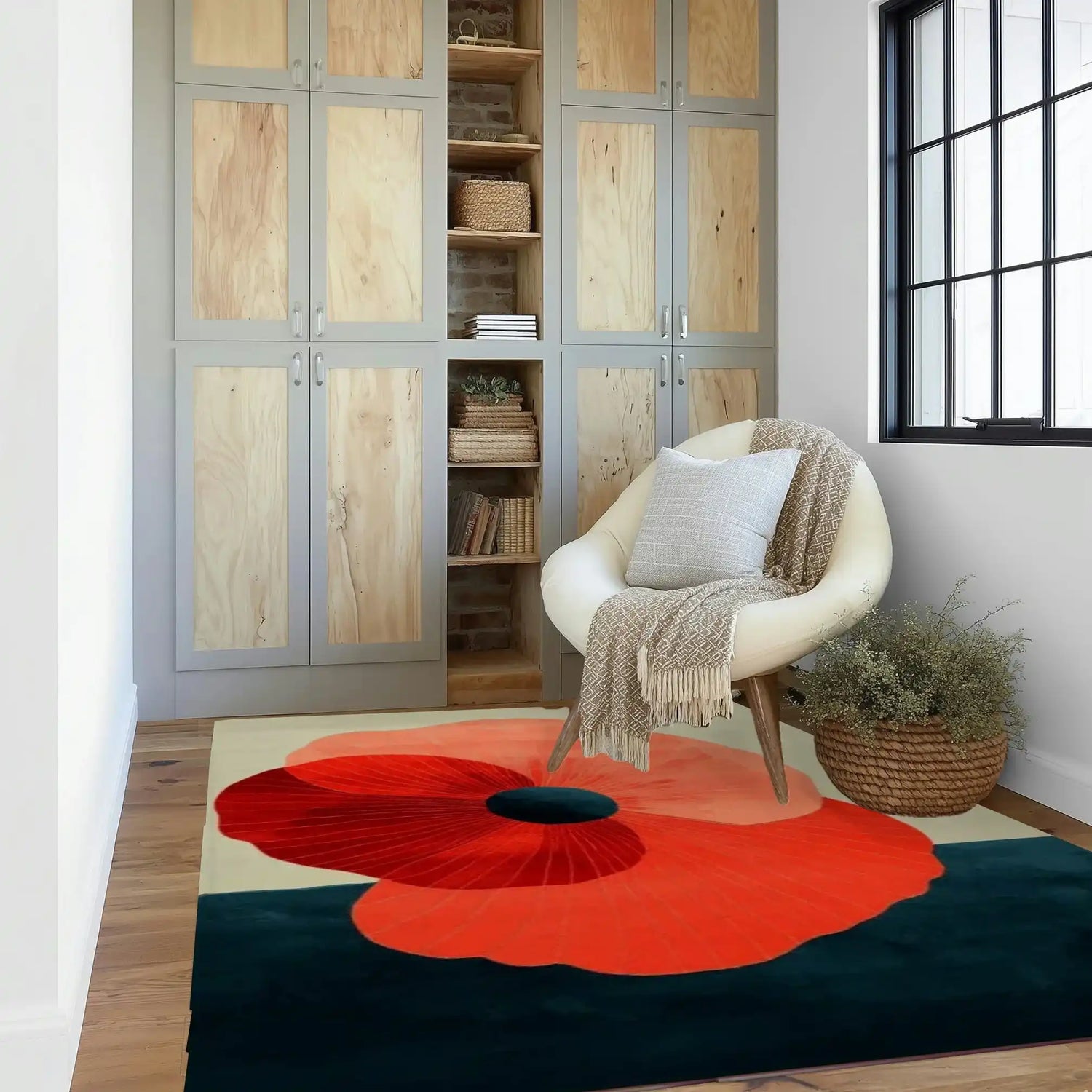 A stylish living room featuring a Floral Fusion Hand Tufted Wool Rug. The contemporary area rug, perfect for large living rooms, showcases a bold floral design in vibrant red and deep blue hues. It's a striking wool rug that adds a touch of elegance to the space, complemented by a modern chair and natural wood cabinets.