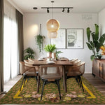A beautifully styled dining room featuring the 'Garden of Courage Hand Tufted Rug'. This vintage area rug, with its elegant floral design, adds warmth to the room. The rug is perfect for dining rooms and bedrooms, offering a cozy touch to any space. Its wool material ensures durability and comfort, making it an ideal choice for bedroom rugs and dining room carpets.