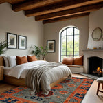 A beautifully styled bedroom showcasing a Garden of Tradition Hand Tufted Area Rug. This large area rug features a striking floral design, perfect for living rooms or offices. The wool rug adds warmth and elegance, complementing the cozy, inviting ambiance of the room.