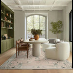 Elegant living room featuring a Gilded Serenity Hand Tufted Area Rug, showcasing its vintage style with intricate wool patterns. The rug perfectly complements the modern furniture and neutral tones, making it an ideal wool rug for living rooms.