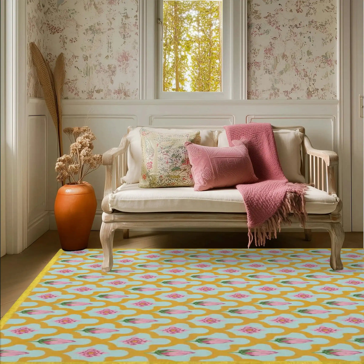 A cozy living room featuring a Gold Border Scallop and Lotus Hand Tufted area rug. The vibrant wool rug, ideal for living rooms, showcases a beautiful pattern of scallops and lotus flowers in pink and gold hues. It's a perfect 8x10 centerpiece for adding warmth and style to your space.