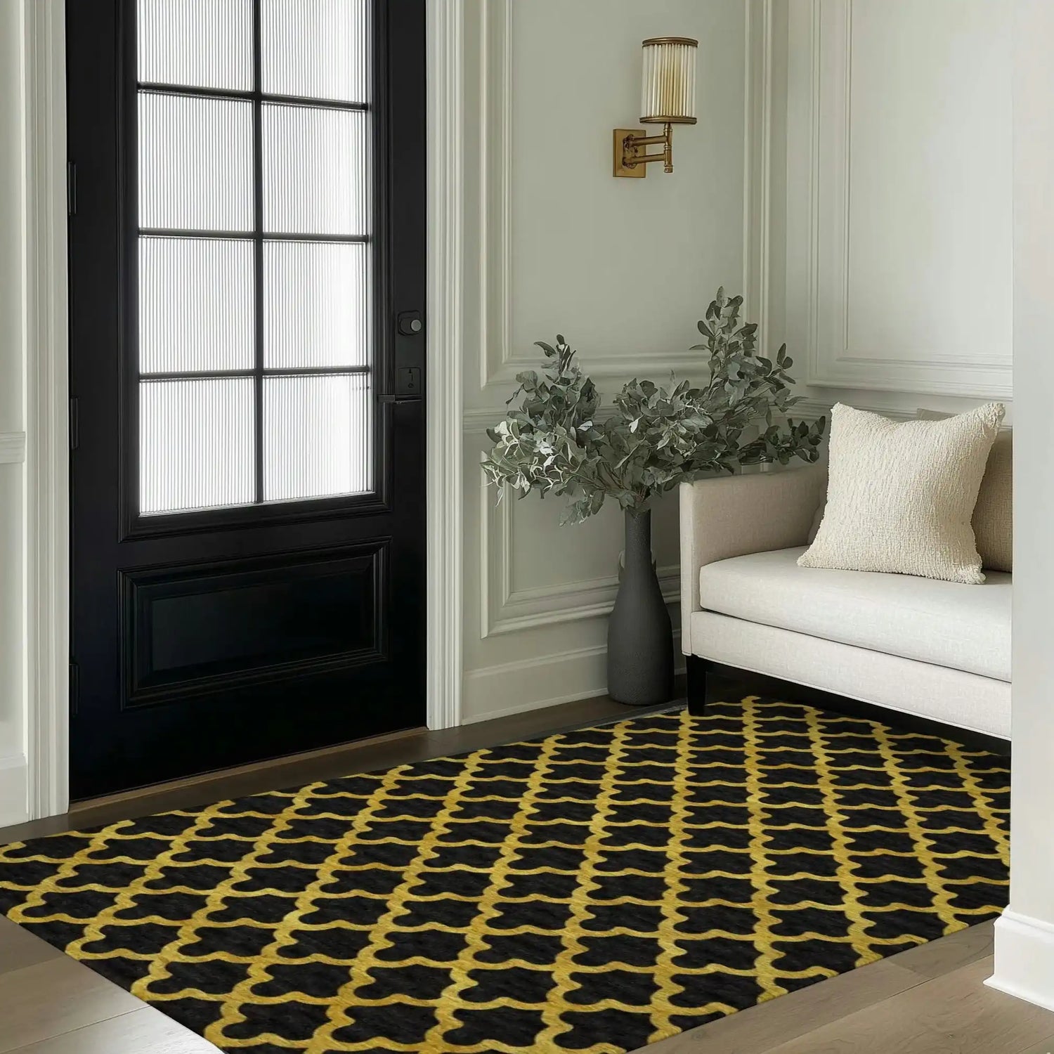 This elegant area rug features a golden Art Deco scale pattern on a black tufted wool surface, perfectly complementing the sophisticated decor of a living room. Positioned in a stylish entryway, the rug adds a touch of luxury and warmth to the space, making it ideal for bedrooms or living room area rugs.