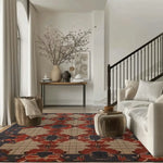 Elegant living room featuring a Gridlock Wool Hand Knotted Area Rug with a vintage design. The square area rug showcases intricate patterns in red and blue, adding a Persian rug charm to the modern setting. Perfect for a living room, this wool rug complements the neutral-toned sofa and minimalist decor, offering a warm and inviting atmosphere ideal for an 8x10 living room space.