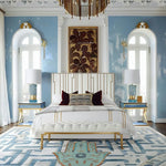 Stylish bedroom featuring a Hamsa Hand Magic Eye wool rug, perfect as an area rug in a dining room setting. The elegant geometric pattern complements the luxurious decor, showcasing its versatility as a dining room carpet.