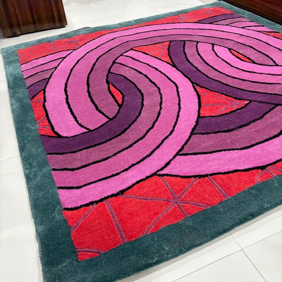 Colorful circular patterned rug on a white floor
