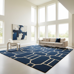 Modern living room with a blue geometric rug, white sofa, and abstract painting.