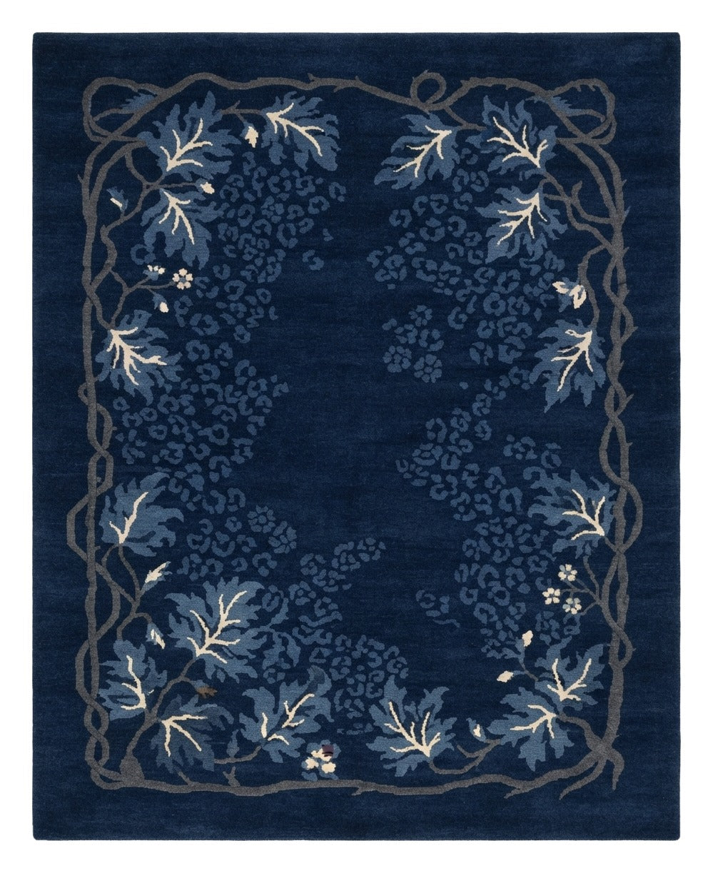 Moonlit Indigo Vine Hand Knotted Rug — navy, blue, white floral rug by Maia Homes on a white background