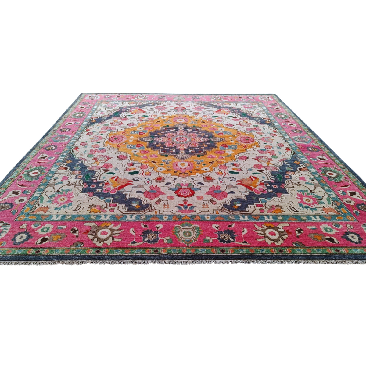 Multicolored hand tufted wool rug with intricate floral medallion design and pink border
