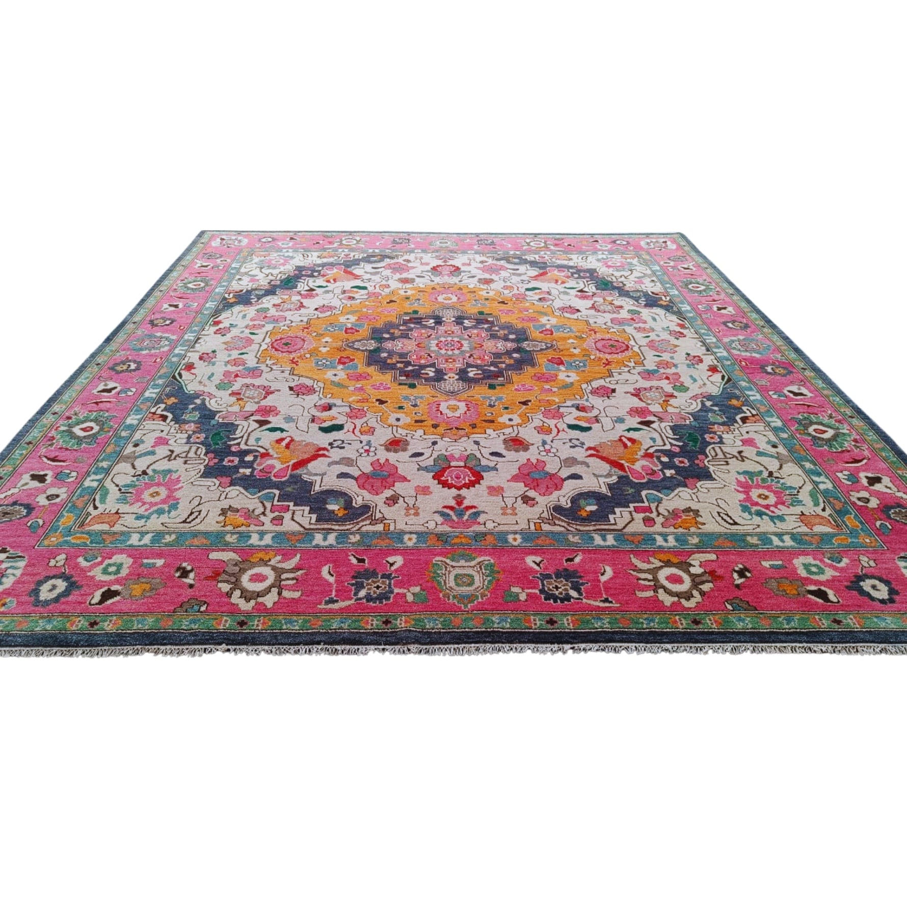 Multicolored hand tufted wool rug with intricate floral medallion design and pink border