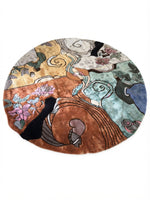 An oval area rug featuring a highly detailed, multicolored Art Nouveau illustration with swirling lines, floral motifs, and stylized figures in shades of brown, teal, pink, black, and gold.