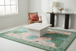 living room with one accent chair and floral green and pink rug