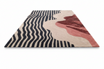 Wavy patterned rug on a checkered floor