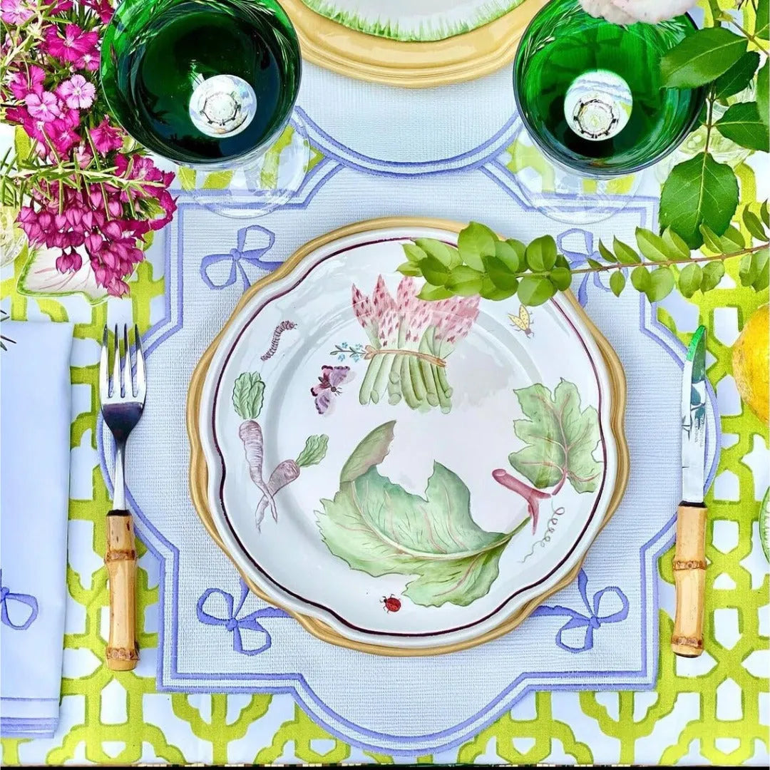 Plum Perfect Placemats, featuring a crisp white base adorned with elegant purple borders. Designed for both style and functionality, these placemats bring a refreshing pop of color to any table setting.