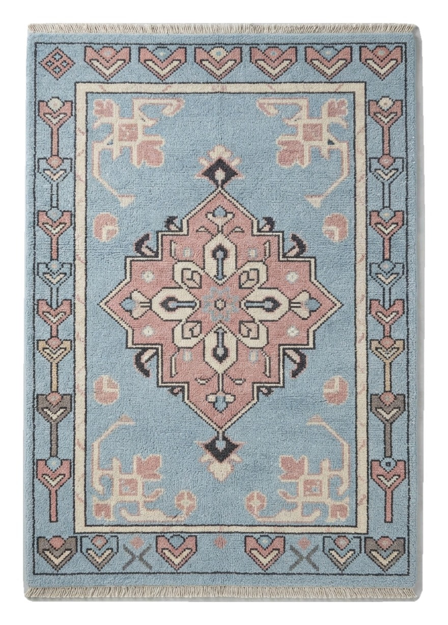 Powder Blue Anatolian Star Hand Knotted Rug — light blue, pink, navy tribal rug by Maia Homes on a white background