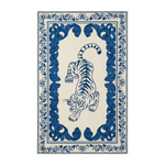 An area rug featuring a central blue tiger illustration surrounded by an ornate blue floral border on an off-white background.