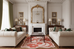 Luxurious living room with white sofas, a fireplace, and decorative floral rug.