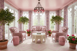Pink-themed sunroom with floral decor, furniture, and plants.