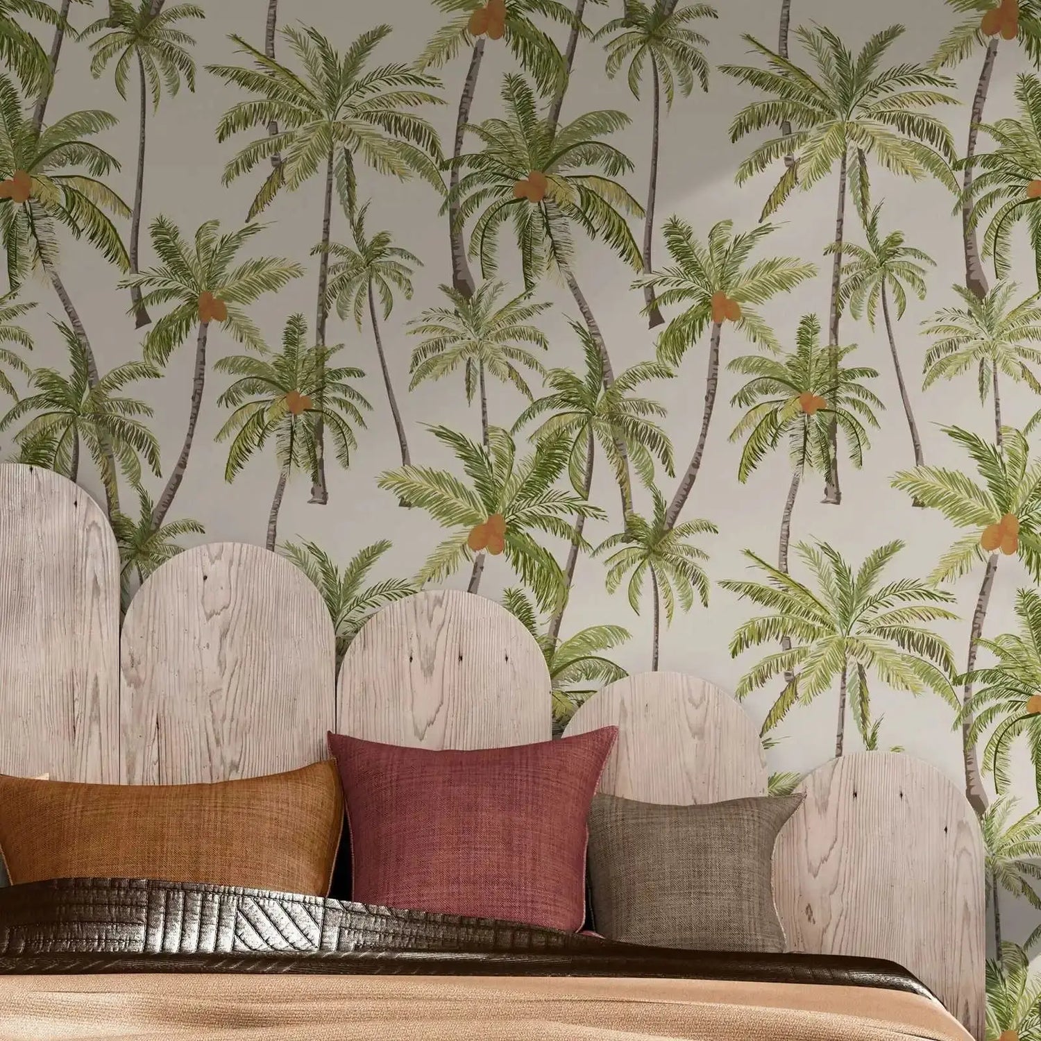 Wallpaper with palm tree pattern behind a wooden headboard with pillows.