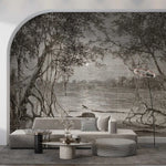 Modern living room with a large wall mural of a forest and lake.