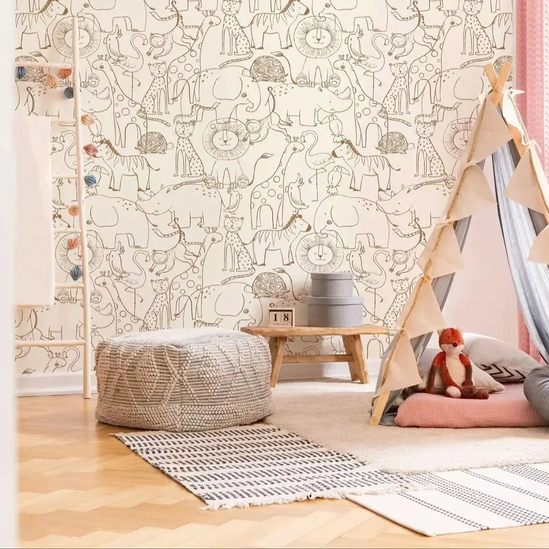 Children's room with animal-themed wallpaper, teepee, and toys.