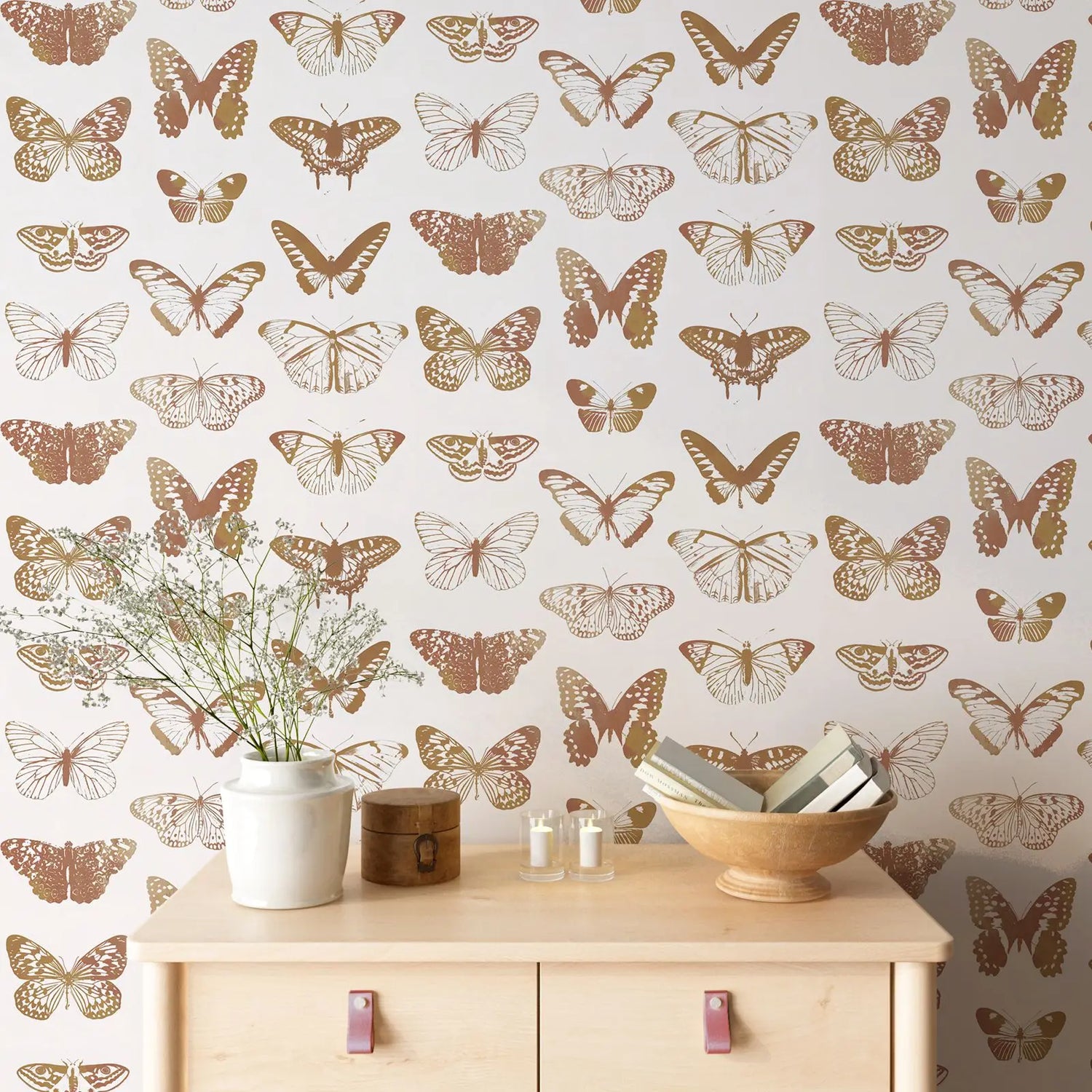 Butterfly patterned wallpaper with a wooden cabinet and decorative items.