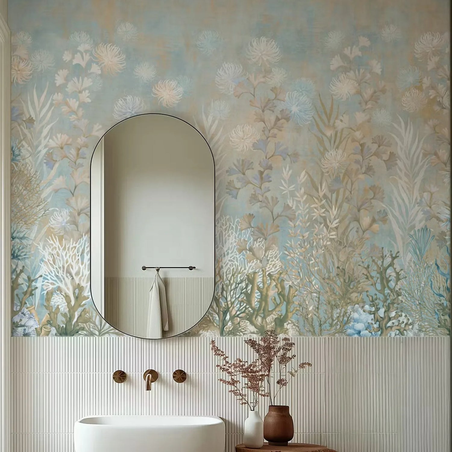 Bathroom with floral wallpaper, oval mirror, and white sink.