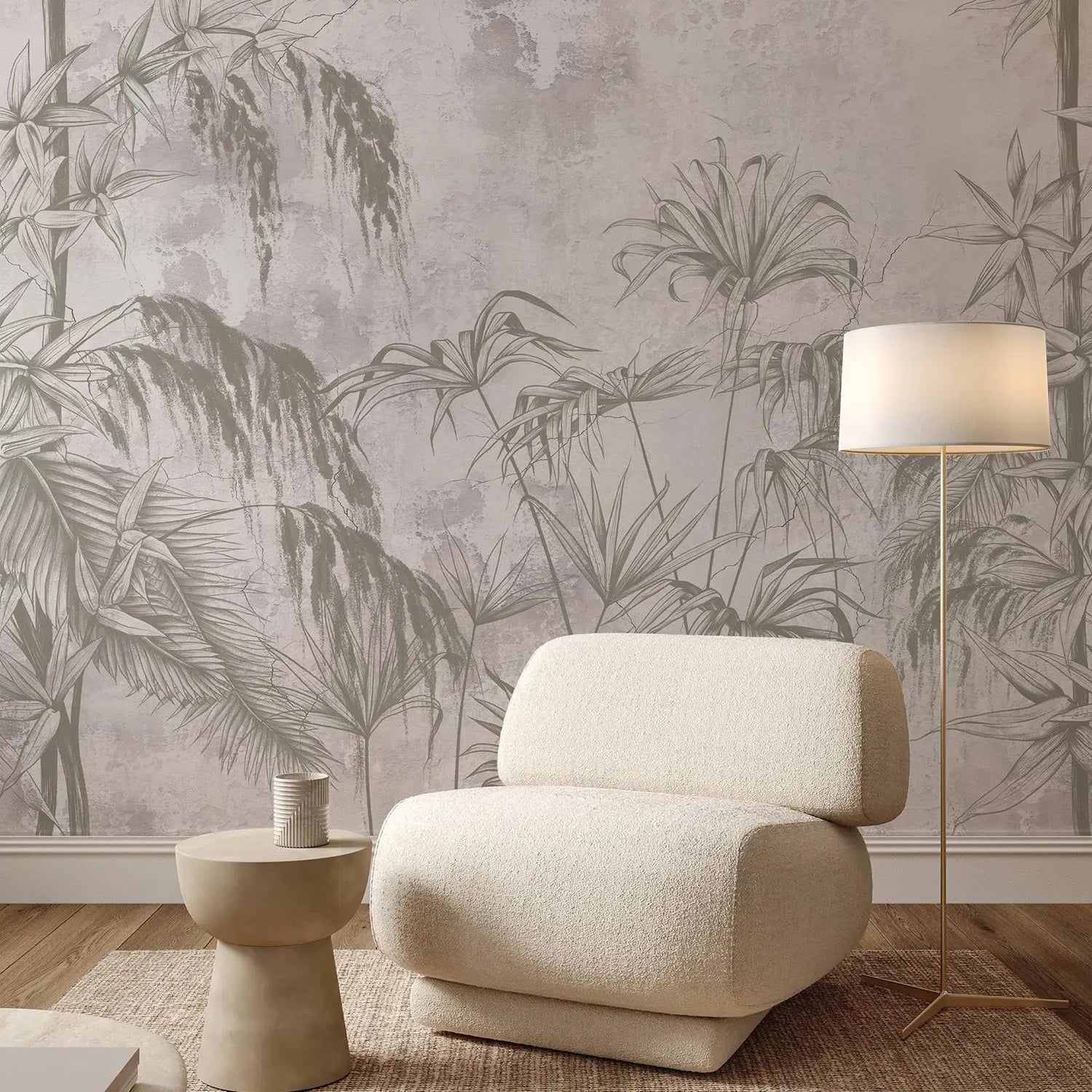 Beige armchair in a room with tropical leaf wallpaper and a floor lamp.